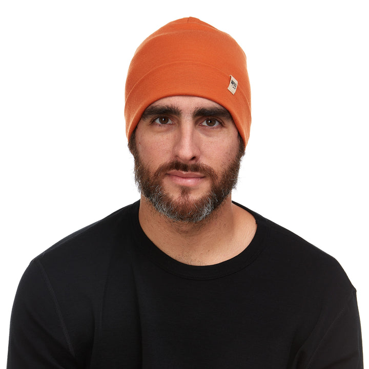 A man models the lightweight, double-layered, hundred percent, super soft merino wool beanie perfect for fall, winter, and spring. This hat is perfect for a hike up the mountain or a walk around the block!
#color_burnt-orange