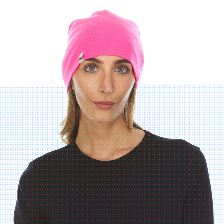 A woman models the lightweight, double-layered, hundred percent, super soft merino wool beanie perfect for fall, winter, and spring. This hat is perfect for a hike up the mountain or a walk around the block!
#color_blaze-pink