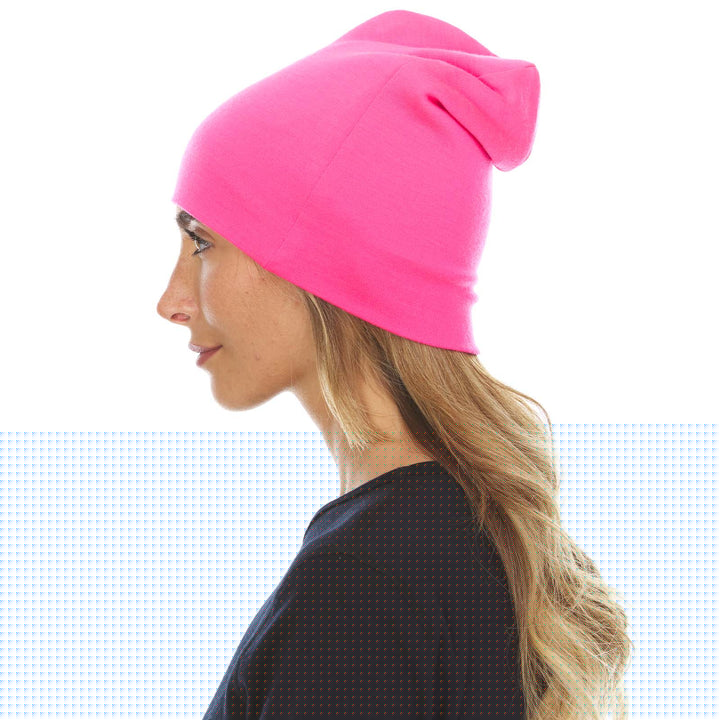 A woman models the lightweight, double-layered, hundred percent, super soft merino wool beanie perfect for fall, winter, and spring. This hat is perfect for a hike up the mountain or a walk around the block!
#color_blaze-pink