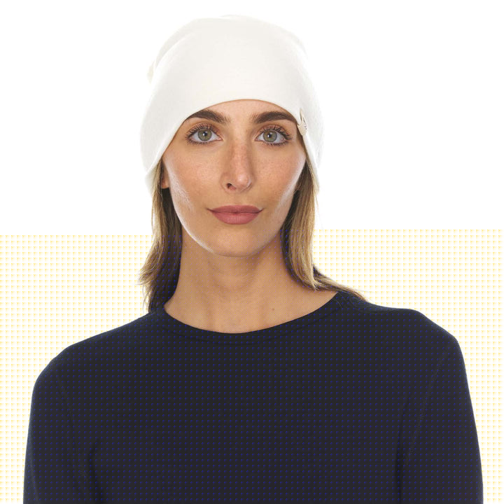 A woman models the lightweight, double-layered, hundred percent, super soft merino wool beanie perfect for fall, winter, and spring. This hat is perfect for a hike up the mountain or a walk around the block!
#color_natural-cream