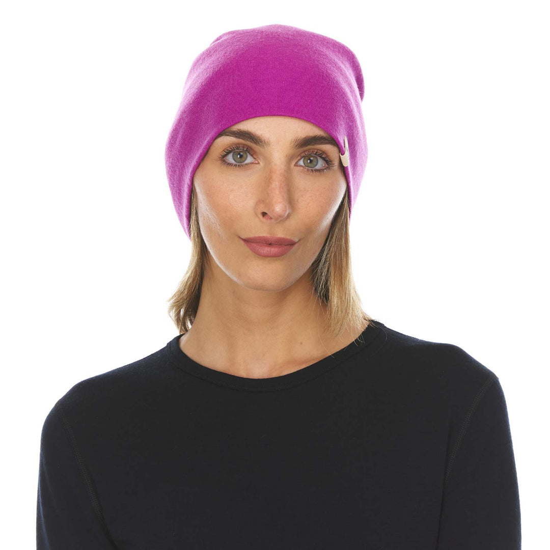 A woman models a lightweight, double-layered, hundred percent, super soft merino wool beanie perfect for fall, winter, and spring. This hat is perfect for a hike up the mountain or a walk around the block!
#color_radiant-violet