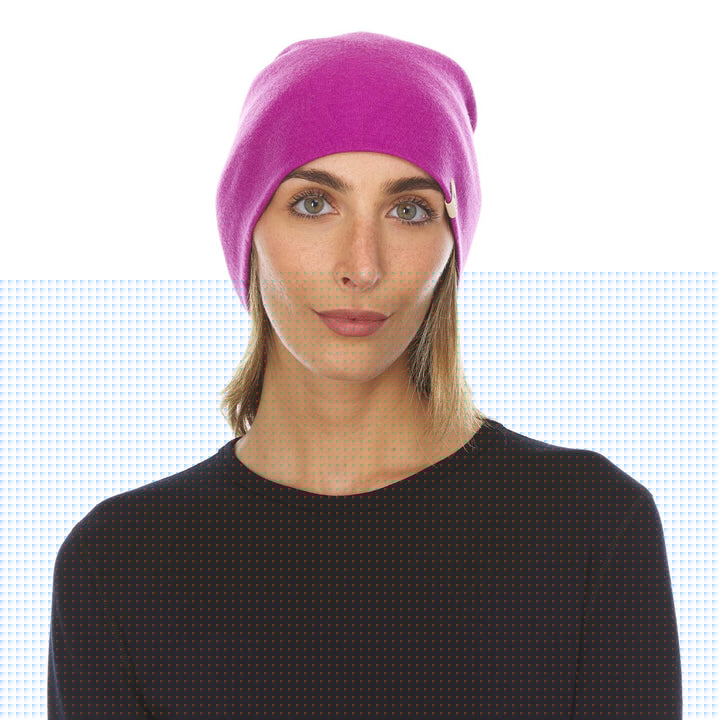 A woman models a lightweight, double-layered, hundred percent, super soft merino wool beanie perfect for fall, winter, and spring. This hat is perfect for a hike up the mountain or a walk around the block!
#color_radiant-violet
