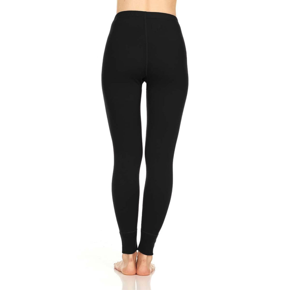A pair of one hundred percent merino wool lightweight women's base layer bottoms. These bottoms feature a gusset between the legs for improved range of motion, and cuffs around the ankles for comfort and style. #color_black
