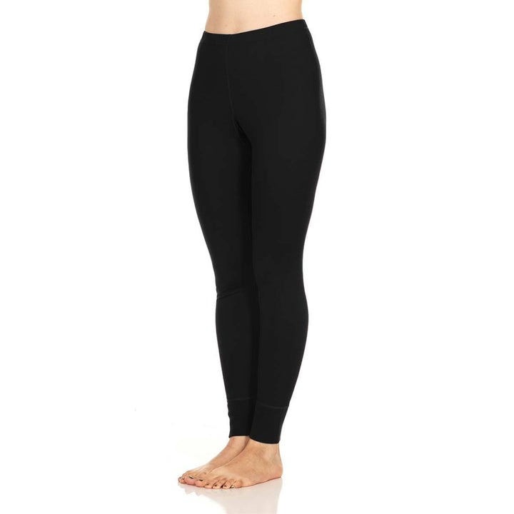A pair of one hundred percent merino wool lightweight women's base layer bottoms. These bottoms feature a gusset between the legs for improved range of motion, and cuffs around the ankles for comfort and style. #color_black