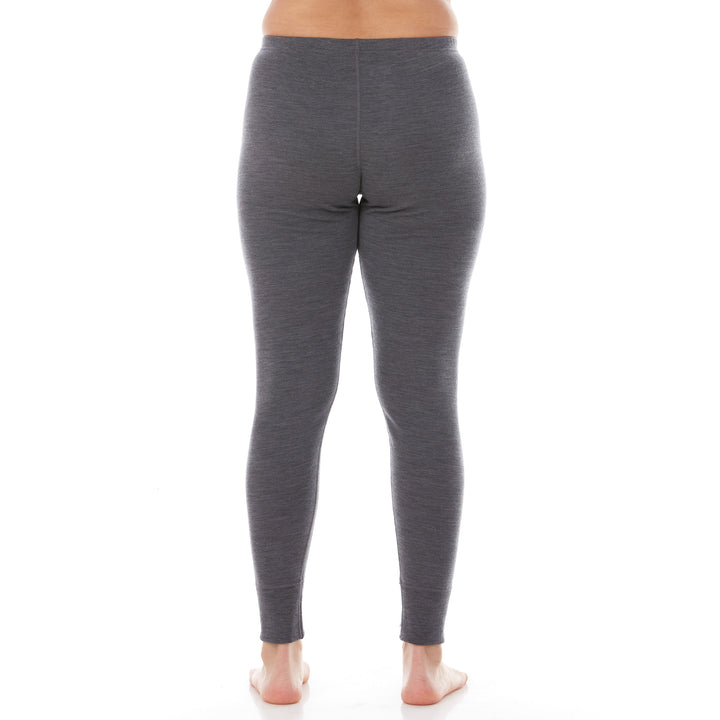 A pair of one hundred percent merino wool lightweight women's base layer bottoms. These bottoms feature a gusset between the legs for improved range of motion, and cuffs around the ankles for comfort and style. #color_charcoal-gray