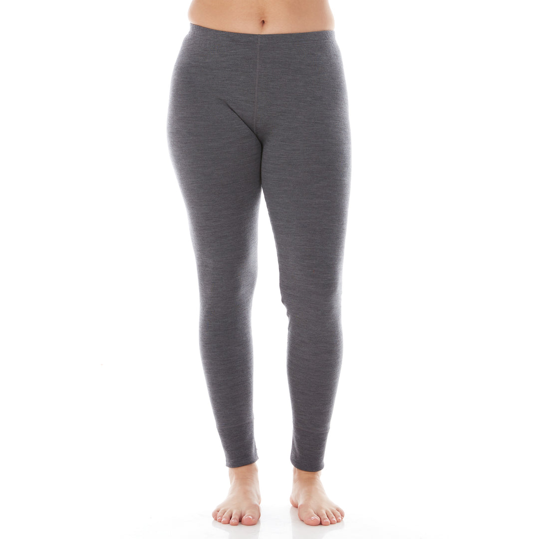 A pair of one hundred percent merino wool lightweight women's base layer bottoms. These bottoms feature a gusset between the legs for improved range of motion, and cuffs around the ankles for comfort and style. #color_charcoal-gray