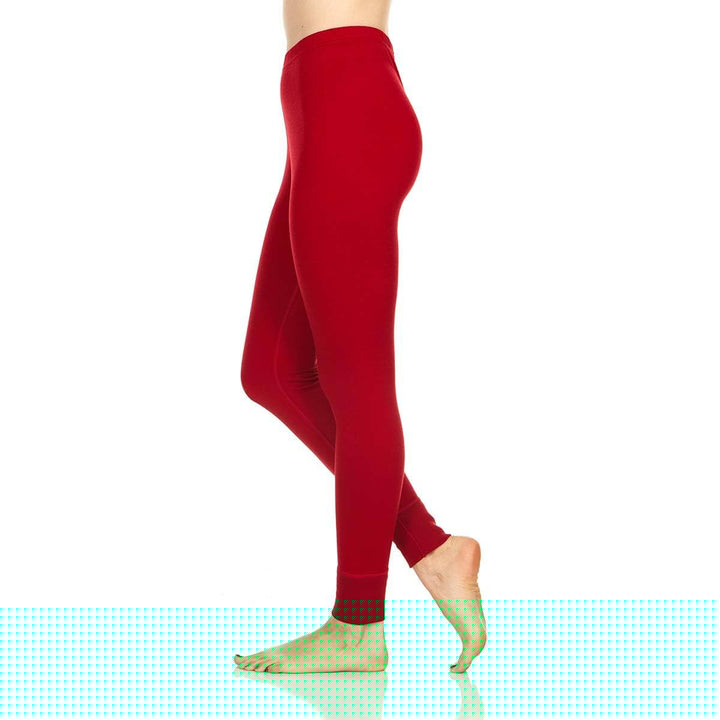 A pair of one hundred percent merino wool lightweight women's base layer bottoms. These bottoms feature a gusset between the legs for improved range of motion, and cuffs around the ankles for comfort and style. #color_true-red