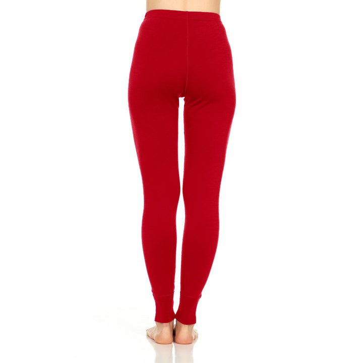 A pair of one hundred percent merino wool midweight women's base layer bottoms. These bottoms feature a gusset between the legs for improved range of motion, and cuffs around the ankles for comfort and style. #color_true-red
