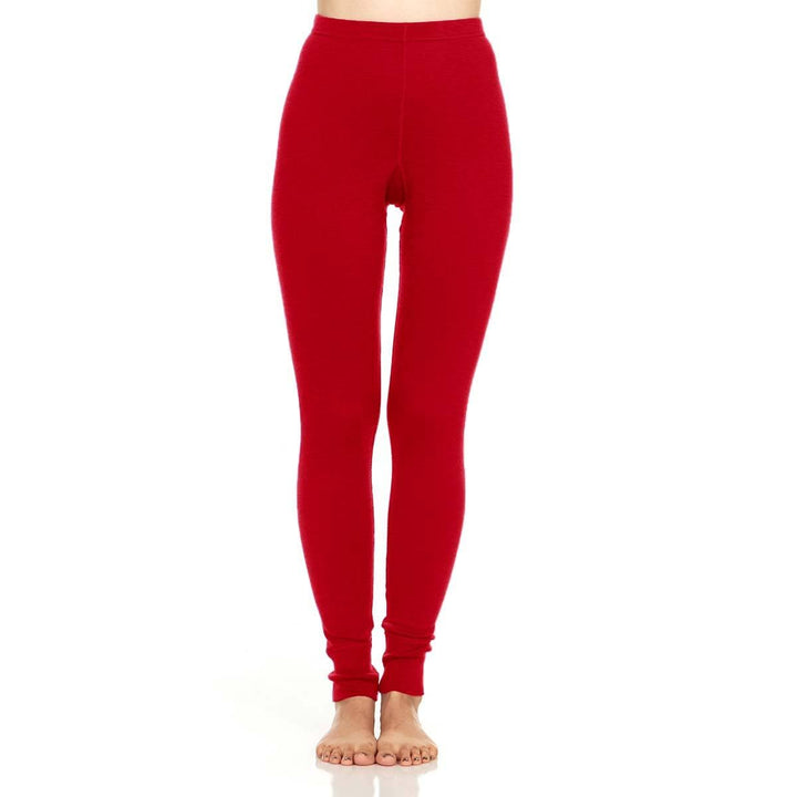 A pair of one hundred percent merino wool midweight women's base layer bottoms. These bottoms feature a gusset between the legs for improved range of motion, and cuffs around the ankles for comfort and style. #color_charcoal-gray